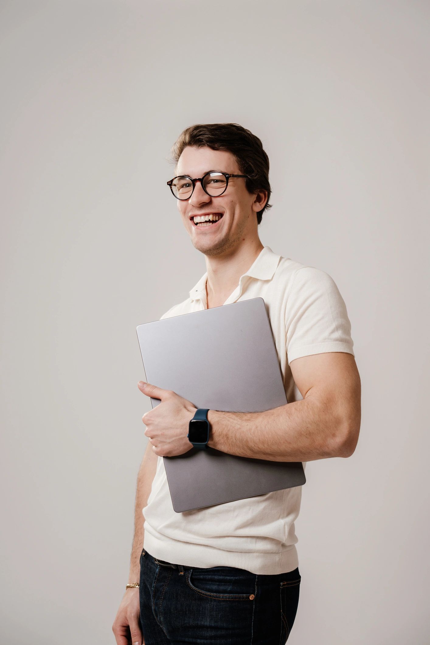 Student holding a laptop, representing application and career development
